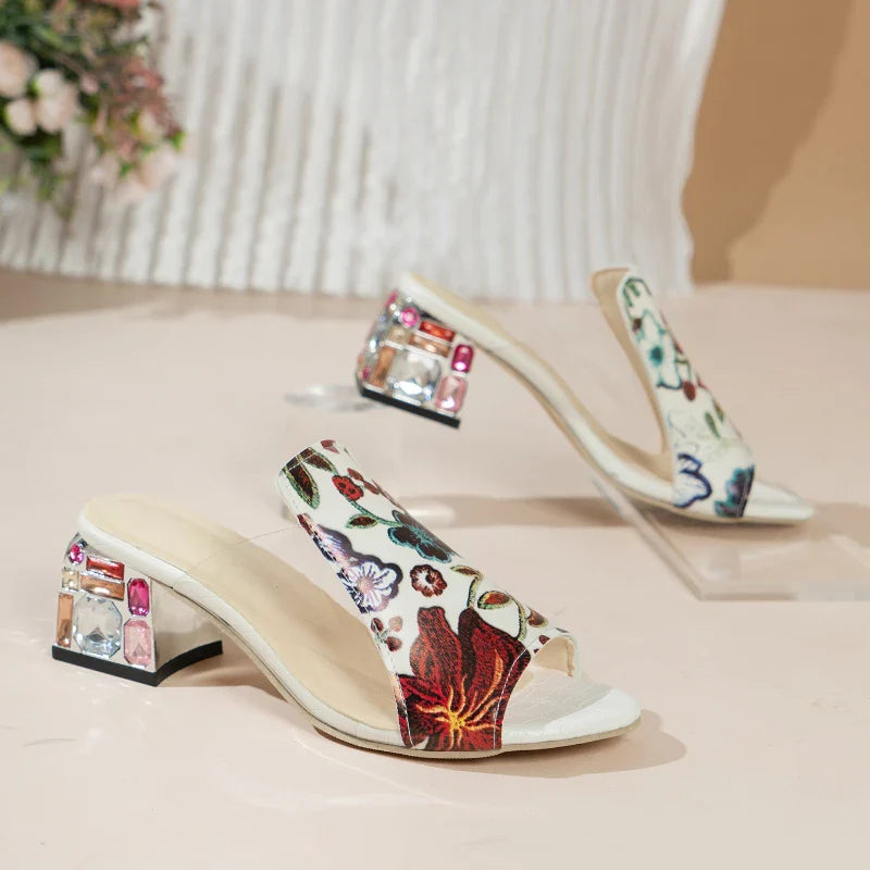 Sophisticated outdoor sandals for women, combining floral elegance and high heel comfort in a sleek, genuine leather design.