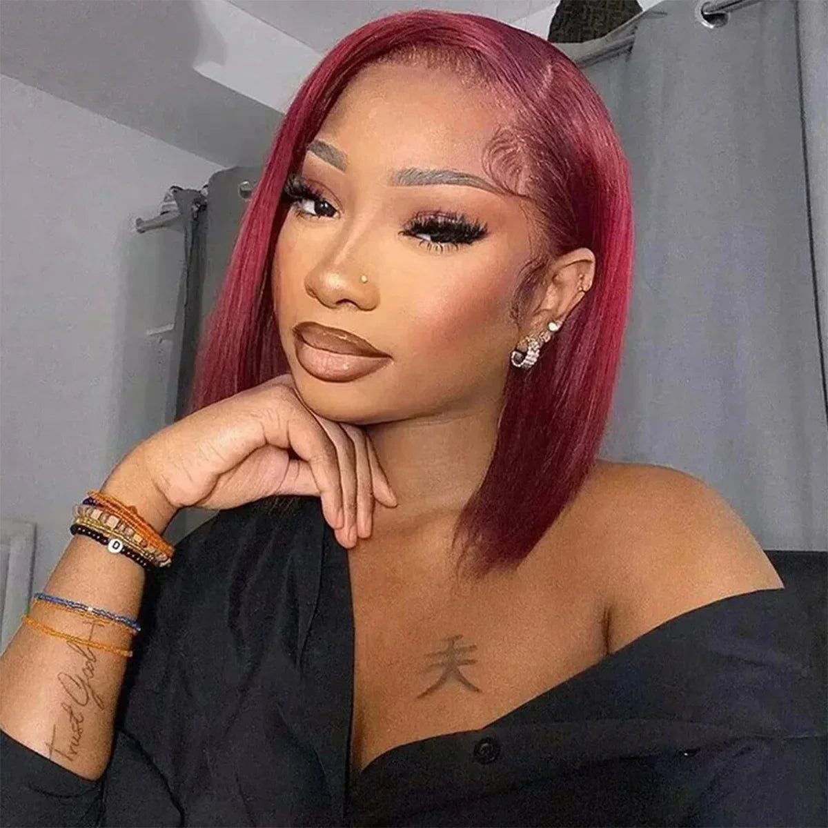 High-quality short Brazilian human hair wig in rich 99J Burgundy, offering a stylish bob cut with pre-plucked hairline for easy styling and comfort.