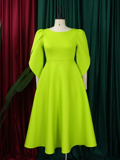 The Wmstar Women's Elegant Dress drapes beautifully on a model, emphasising its mid-calf length and A-line silhouette, ideal for sophisticated summer events.