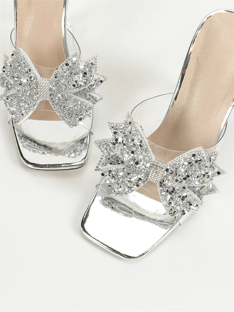 Sophisticated transparent high heels by Liyke, showcasing a trendy square toe and an exquisite butterfly knot, perfect for upscale occasions.