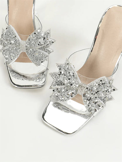 Sophisticated transparent high heels by Liyke, showcasing a trendy square toe and an exquisite butterfly knot, perfect for upscale occasions.
