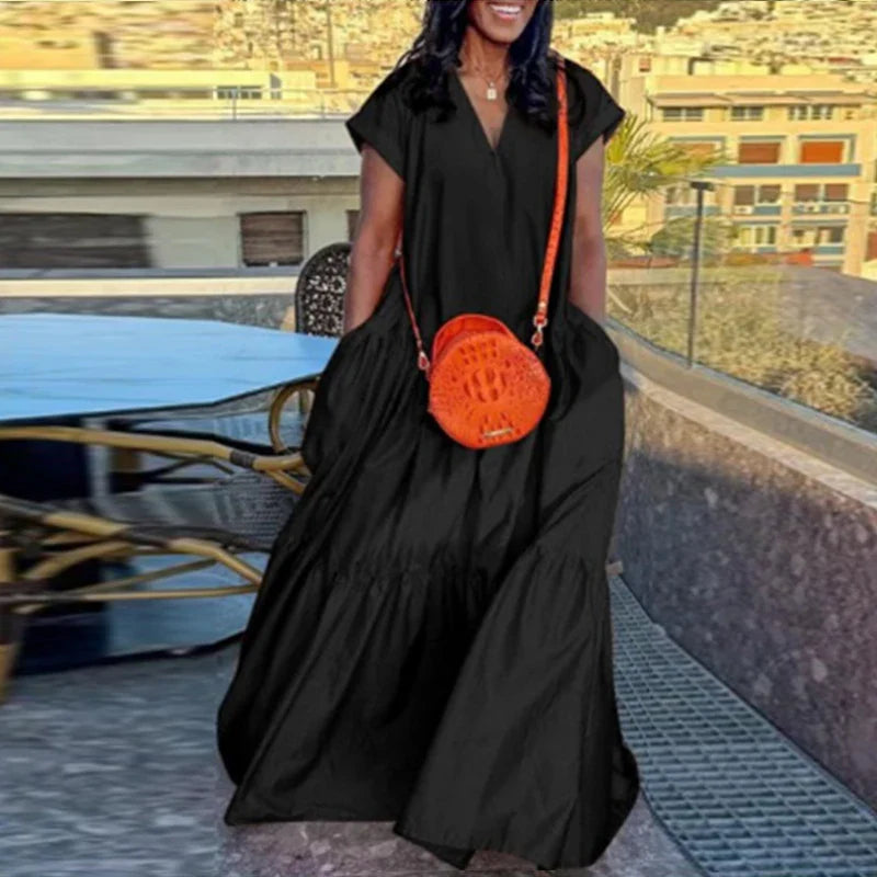 Elegant plus-size women’s bohemian summer sundress in solid colour, showcasing a loose fit and short sleeves, perfect for casual outings or beachwear.