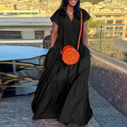 Elegant plus-size women’s bohemian summer sundress in solid colour, showcasing a loose fit and short sleeves, perfect for casual outings or beachwear.