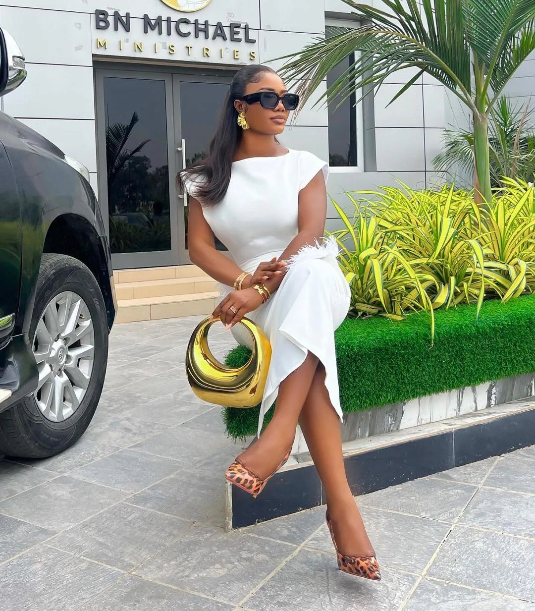 Sophisticated slim fit sheath dress for women, perfect for office wear, showcasing delicate feather accents and an ankle-length silhouette.