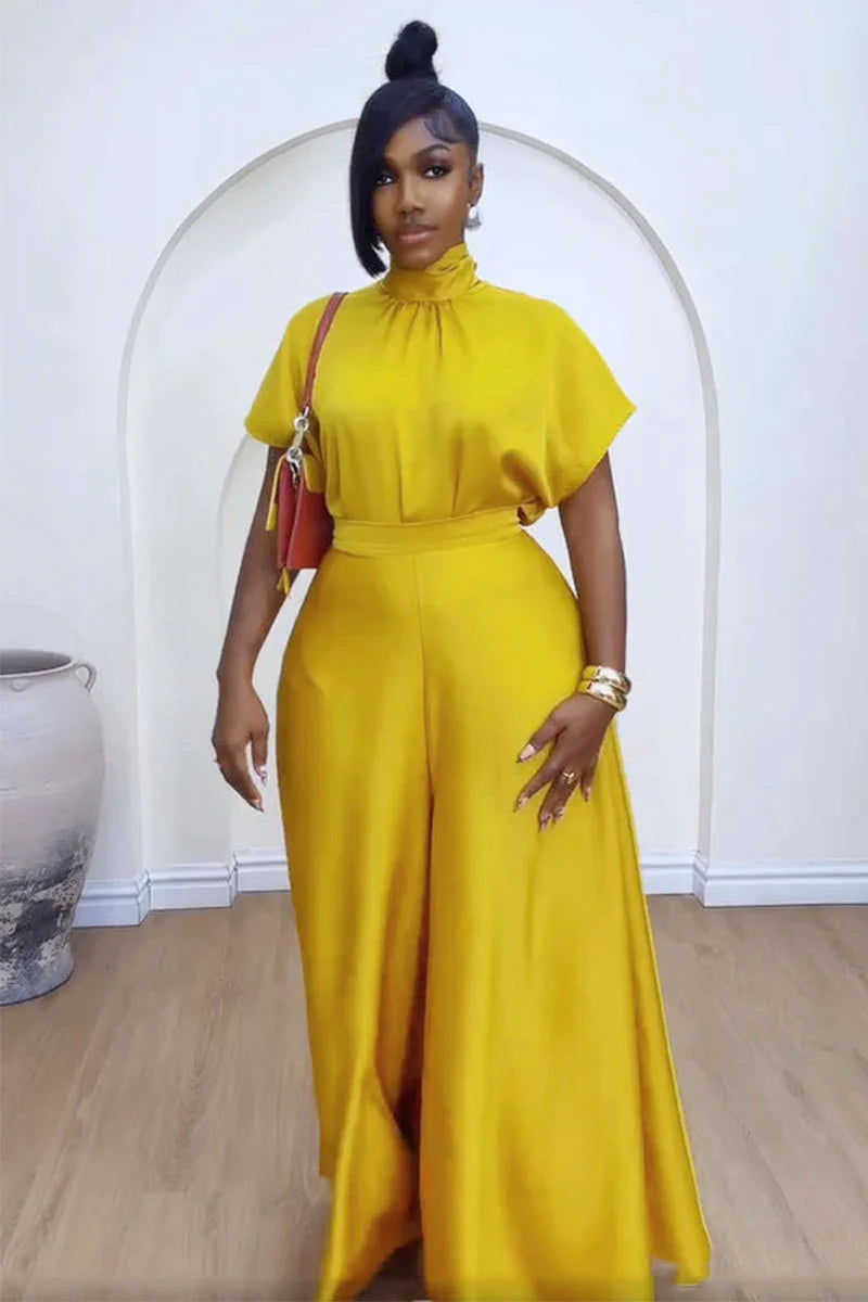 Stylish full view of African women's matching outfit, featuring a refined wide leg pant and a graceful lace-up top, perfect for all occasions.