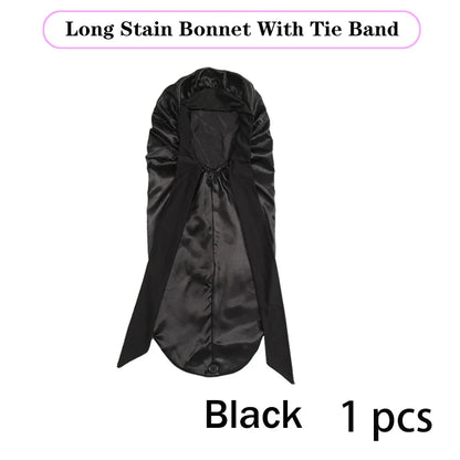 Soft and glamorous silk bonnet with tie, designed for ultimate hair protection while sleeping, trendy and functional for modern hair care enthusiasts.
