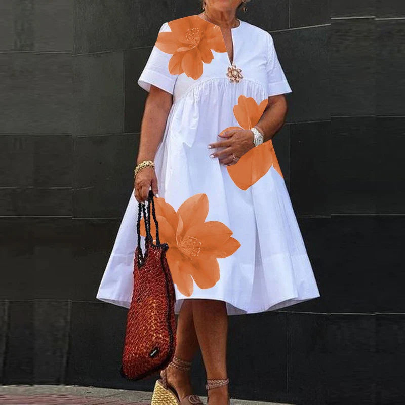 Close-up view of Modigirl Plus Size Midi Dress, showcasing soft cotton blend fabric with slight stretch, adorned with delicate floral patterns, ideal for chic casual wear.