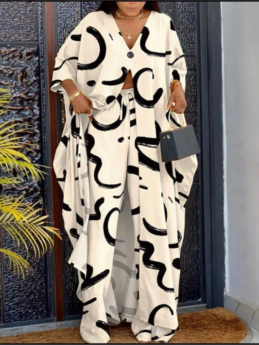 Elegant women's V-neck loose long-sleeved top, showcasing a striking letter print design, paired with wide leg pants, epitomizing casual luxury.