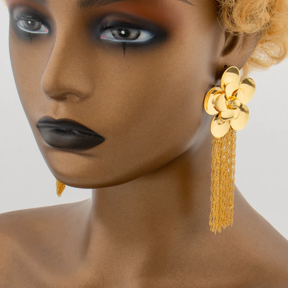 Elegant close-up of fashion retro ethnic tassel earrings, beautifully designed in gold, ideal for special occasions and gifting.