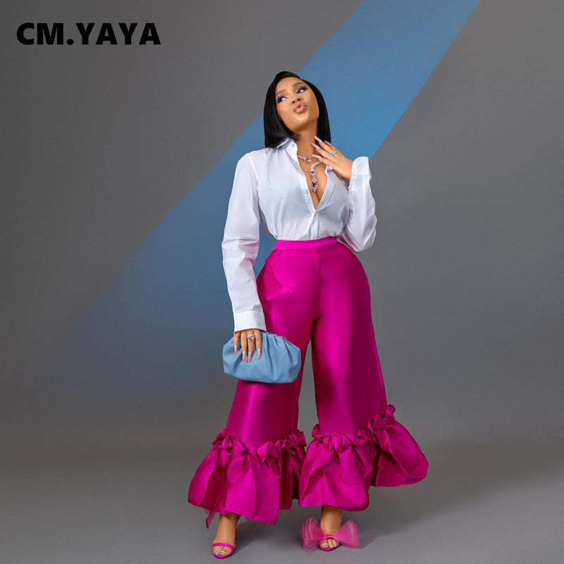 Model wearing CM.YAYA Women’s Elegant Ruffle Hem High Waist Loose Wide Leg Flare Pants, highlighting luxurious summer styling.