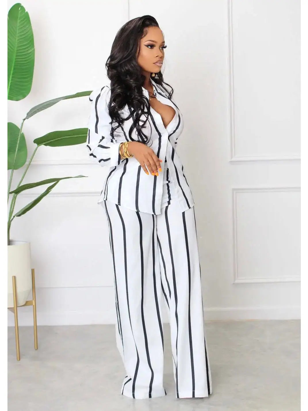 Elegant women's luxe casual two-piece striped set featuring long pants and a matching shirt in a sophisticated style.