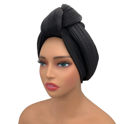 Sophisticated women's turban glitter knot head wrap on a stylish background, crafted from premium polyester, perfect for all seasons.