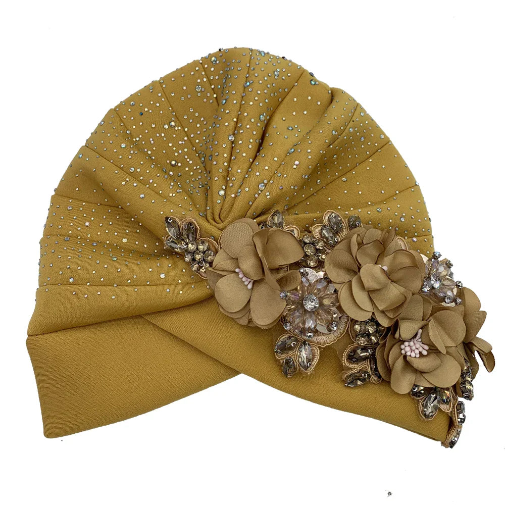 Elegant African turban cap adorned with sparkling rhinestone accents, perfect stylish head wrap for women, in luxurious design.