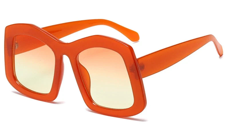 Stylish women's sunglasses featuring oversized square frames in striking orange gradient, perfect for sunny days and outdoor elegance.
