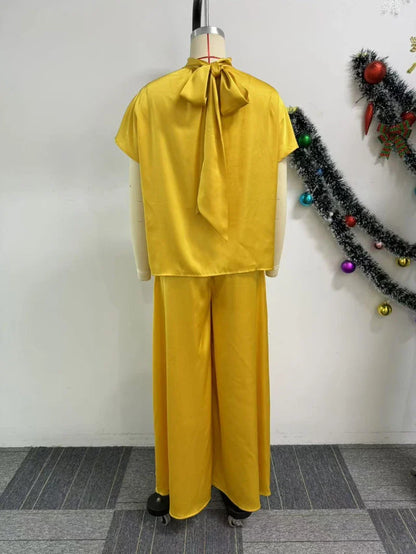 Luxurious African women's fashion satin lace-up top featuring elegant design elements, ideal for sophisticated occasions.