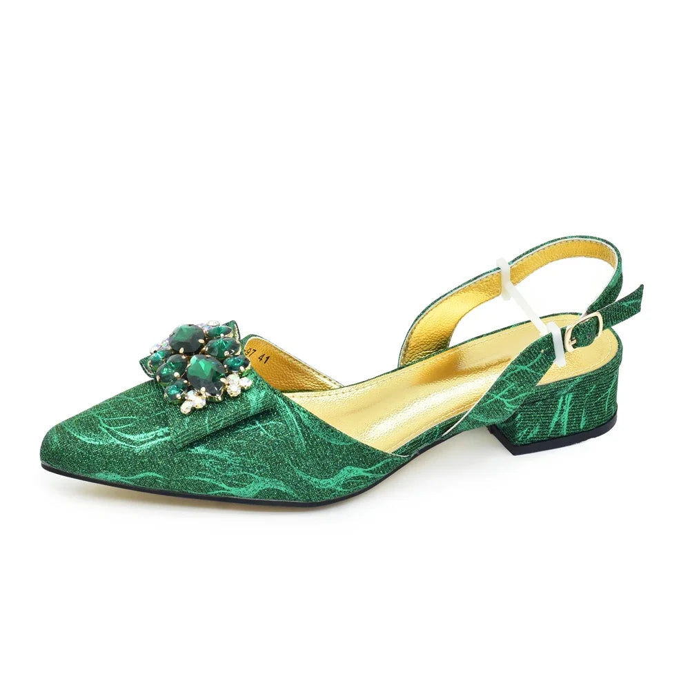 Elegant ladies low heel pumps adorned with rhinestones, paired beautifully with a matching handbag in luxurious green, suitable for parties.