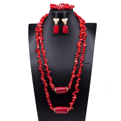 Stylish display of the Luxury African Beads Jewelry Set including the statement necklace, earrings, and bracelet, highlighting the vibrant artificial coral materials and luxurious craftsmanship.