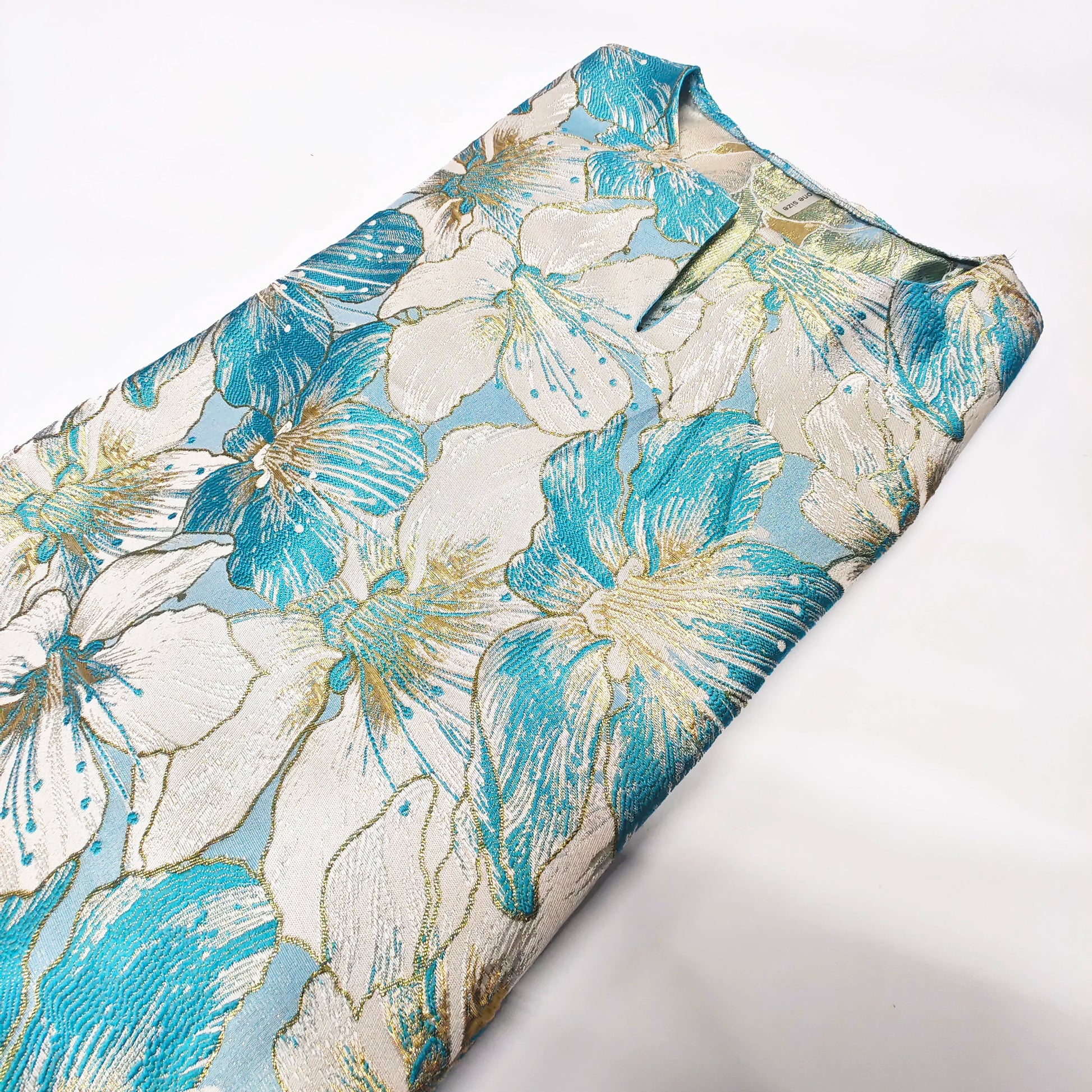 Stylish African dashiki dress displayed on a mannequin, highlighting its rich cotton and polyester blend and the luxurious feel of traditional African clothing.