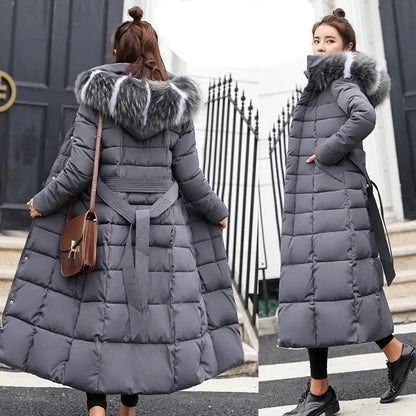 Sophisticated long coat for women, designed with a plush fox fur collar and adjustable waist for a tailored fit.