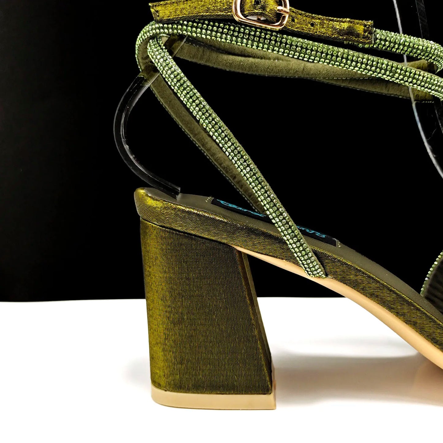 Sophisticated olive green handbag matching with high heel pumps, adorned with rhinestones for an exquisite party look.