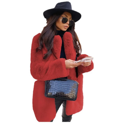Luxury women's long sleeve faux fur coat elegantly draped, showcasing its lapel and pockets, ideal for winter style.
