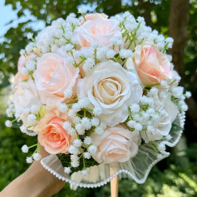 Chic silk wedding bouquet with baby's breath and pearl lace, a refined choice for brides and bridesmaids.