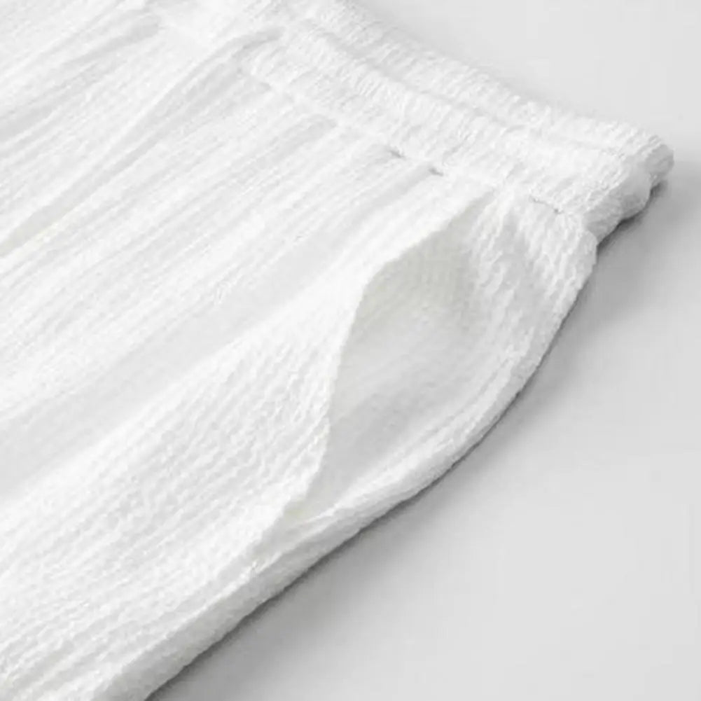 Sleek men's casual summer ensemble with a comfortable elastic waist and mandarin collar shirt, excellent for luxurious leisurewear.