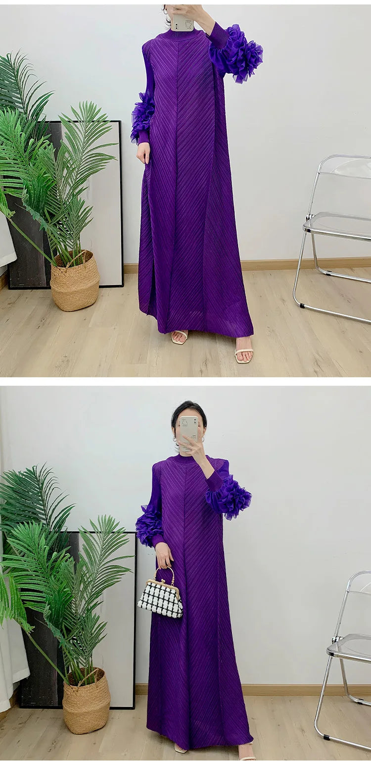 Full length view of a woman in a sophisticated ankle-length pleated dress, ideal for office and formal events.