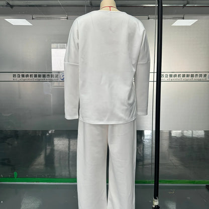 Stylish women's two-piece set featuring a solid full sleeve O-neck top and elegant midi waist long pants with pockets, perfect for autumn and winter fashion.