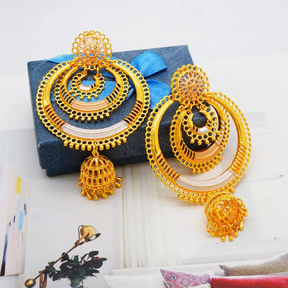 Stylish gold drop earrings with intricate detailing, perfect for enhancing any wedding attire.