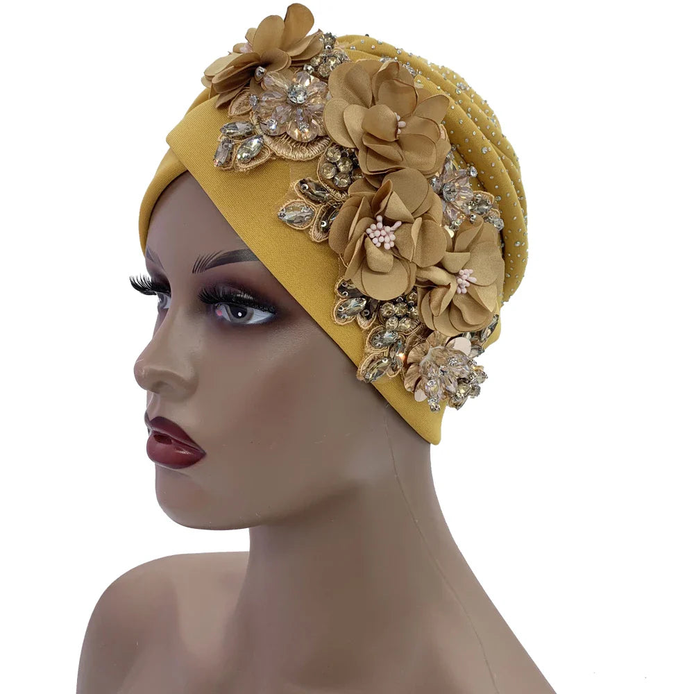 Close-up view of the exquisite rhinestone detailing on an elegant African turban cap, showcasing opulence and sophisticated design.