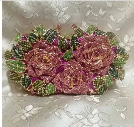 Elegant close-up of a metallic leather clutch purse featuring a unique minaudière design and shimmering crystal accents, ideal for evening events.