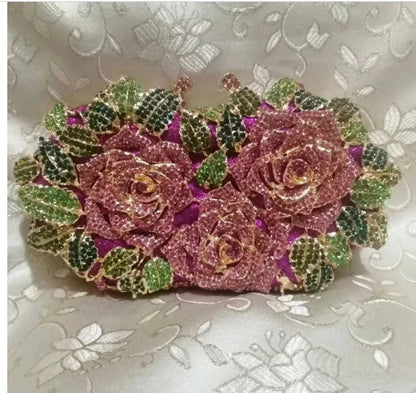 Elegant close-up of a metallic leather clutch purse featuring a unique minaudière design and shimmering crystal accents, ideal for evening events.