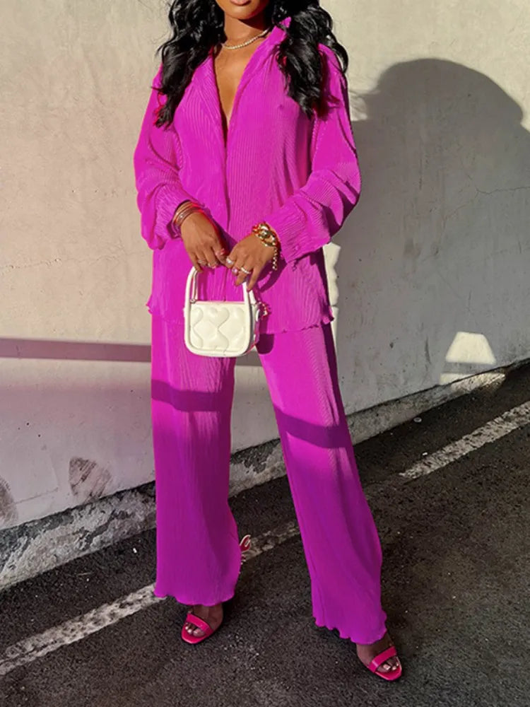 Luxuriously crafted pleated shirt and wide leg pants ensemble, perfect for middle-aged women seeking elegance and comfort.