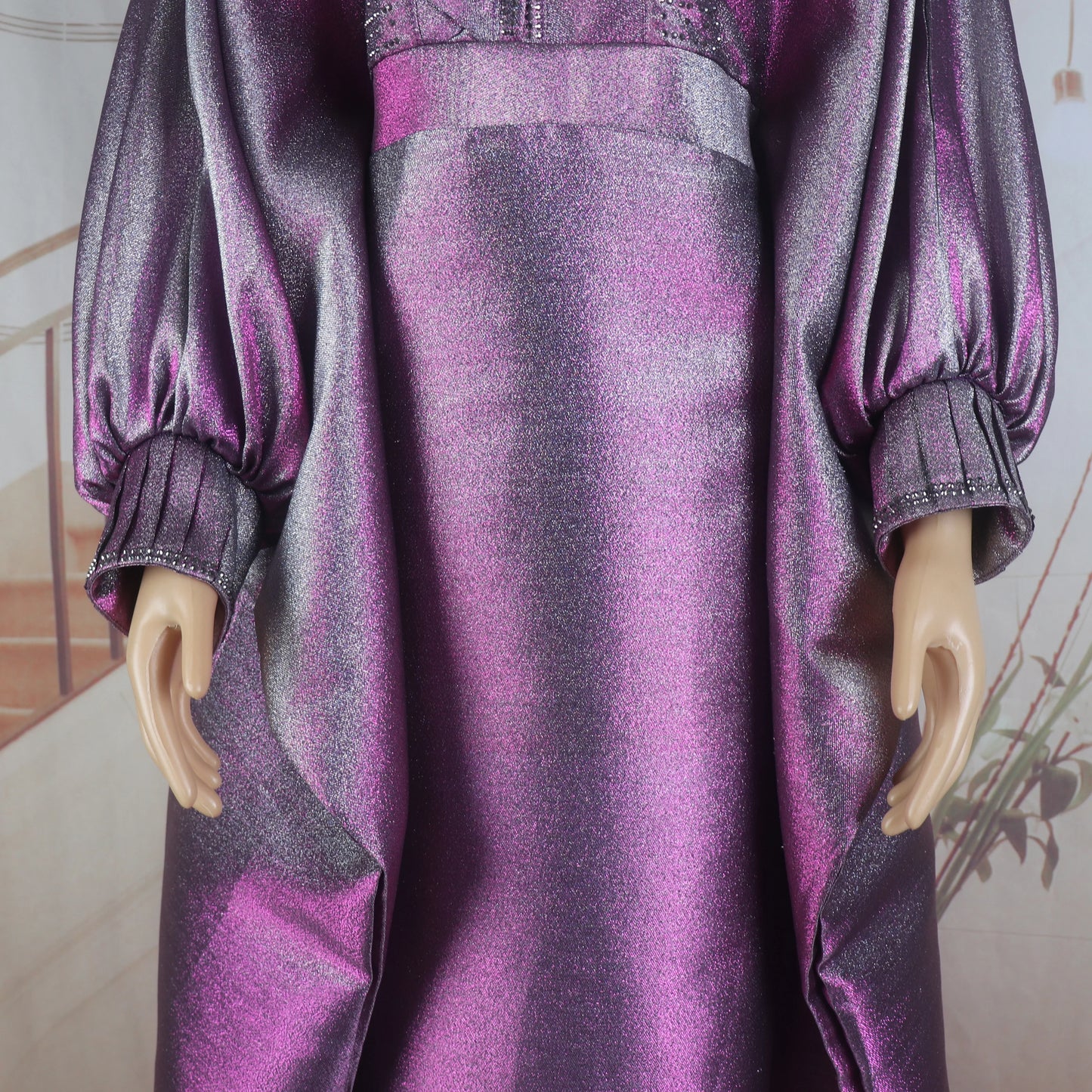 Rear view of a woman wearing a stylish and thick luxury turkey dress with V-neck and intricate rhinestone design, perfectly suited for church gatherings.