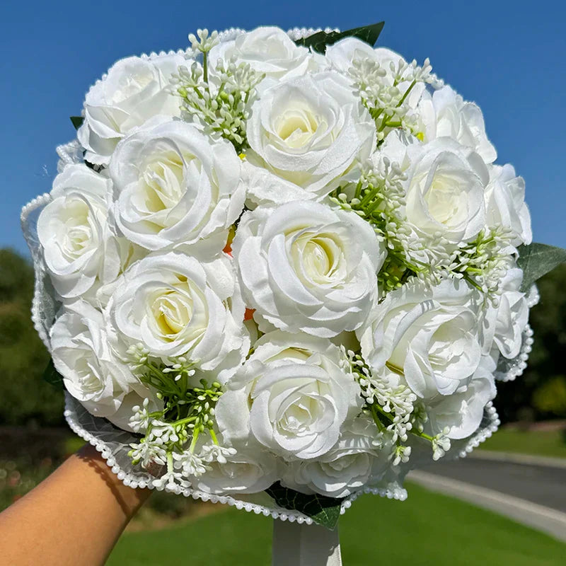 Luxurious floral arrangement with silk roses and babysbreath, adorned with exquisite pearl lace, perfect for weddings.