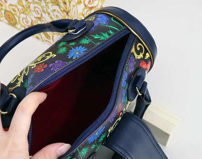 Interior view of a spacious women's Boston barrel handbag, showcasing multiple pockets for organisational convenience, designed in trendy animal print with a luxurious finish.