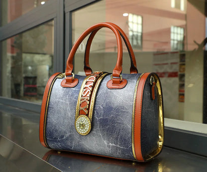 Sophisticated large-capacity Boston handbag for women, made of soft microfiber leather and adorned with a fashionable animal print, a must-have accessory.