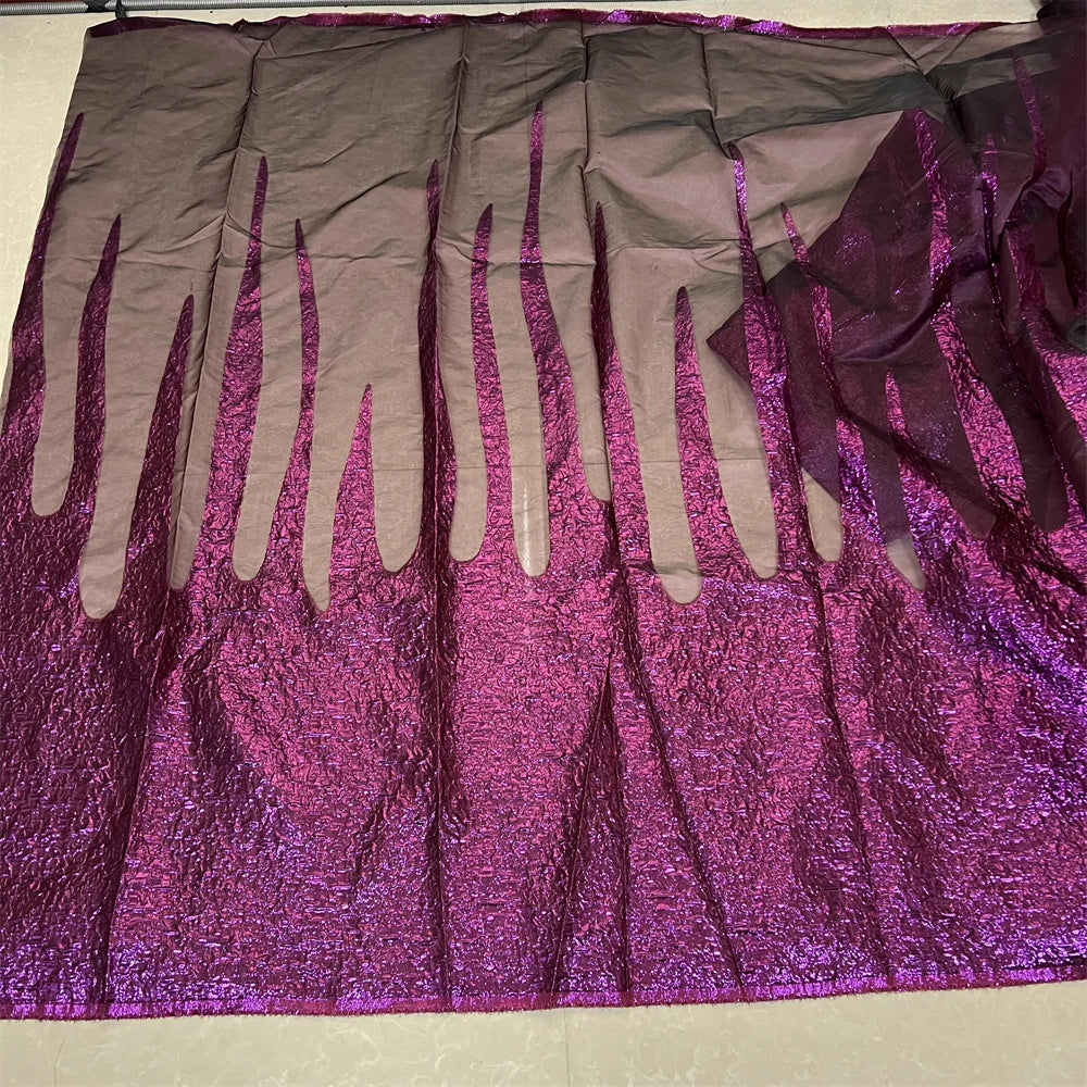 High-quality Nigerian lace fabric displayed elegantly, ideal for creating custom bridal gowns, exuding luxury and timeless beauty.