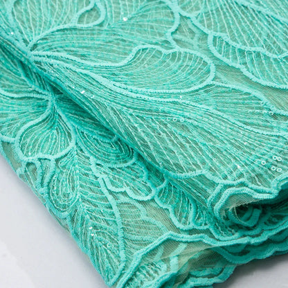 Elegant wedding dress fabric made of high-quality polyester and nylon, showcasing intricate embroidery and luxurious silk feel.