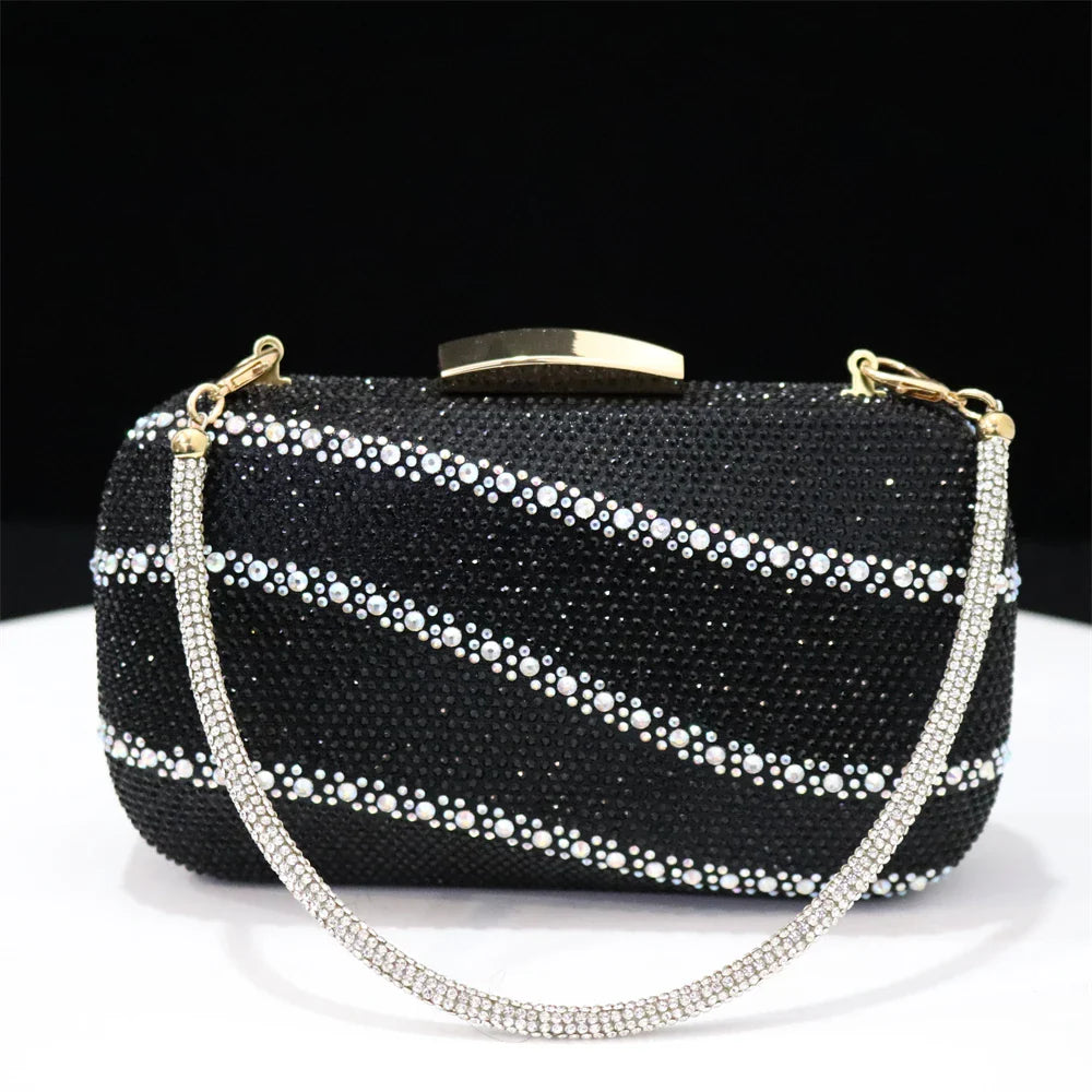 Matching black handbag set from Venus Chan, beautifully crafted with a metal handle and chain strap, perfect for pairing with glamorous outfits.