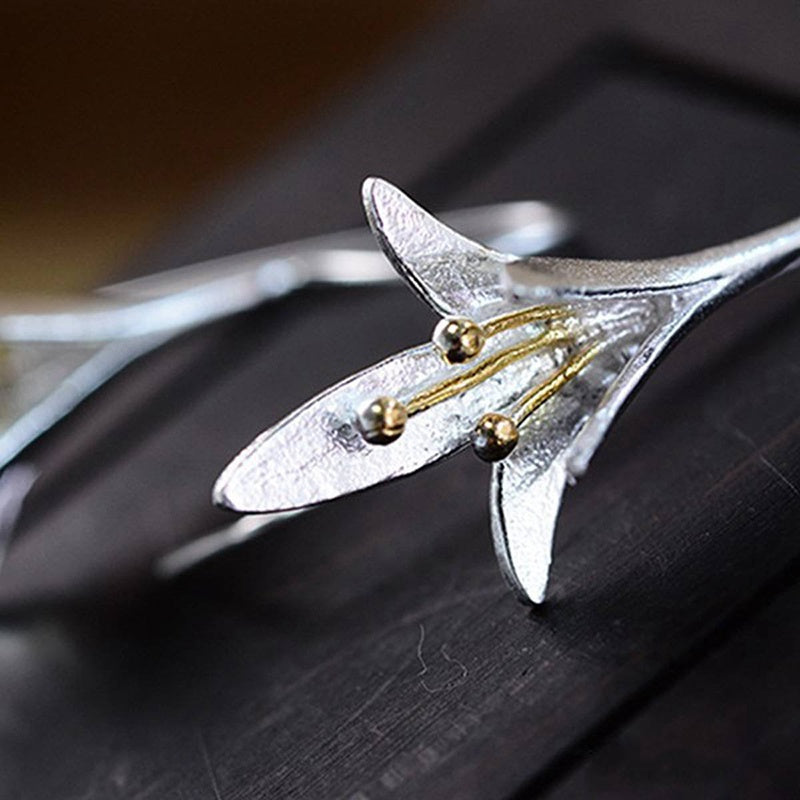 Stylish silver drop earrings featuring a delicate floral design, crafted from durable zinc alloy, ideal for weddings and parties.