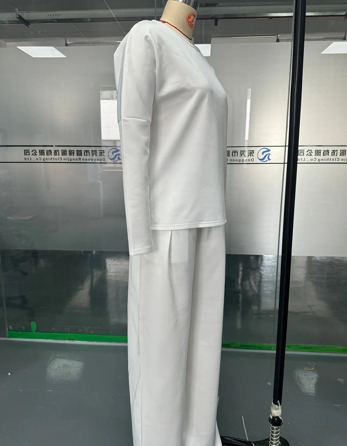 Close-up of the luxurious women's two-piece outfit showcasing the soft cotton linen fabric and the graceful O-neckline of the top.