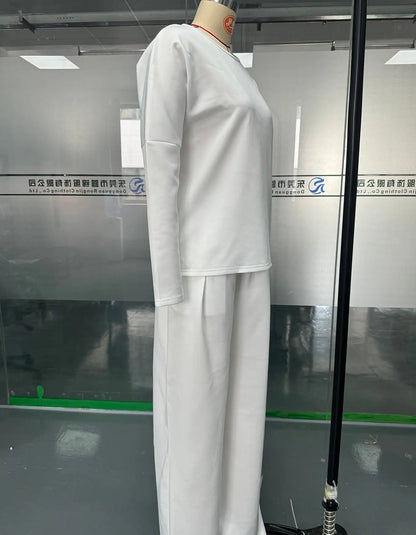 Close-up of the luxurious women's two-piece outfit showcasing the soft cotton linen fabric and the graceful O-neckline of the top.