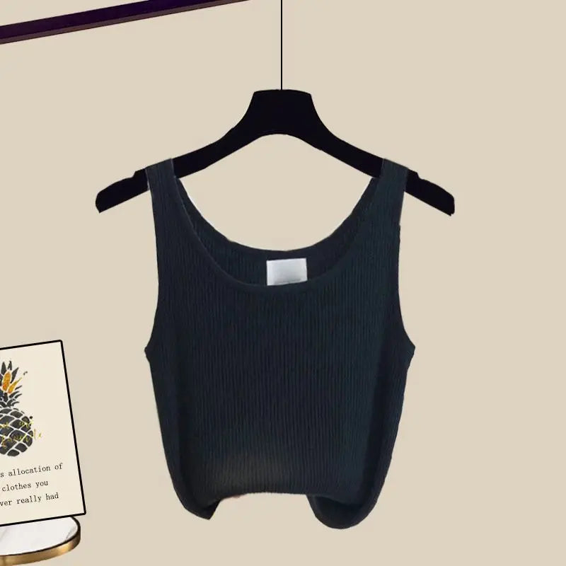 Full outfit display of women's stylish vest, long sleeve shirt, and wide leg jeans, embodying spring/summer luxury fashion.