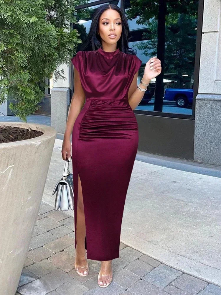 The stylish and sophisticated Burgundy Plus Size Bodycon Dress with a slit, perfect for creating a striking impression at cocktail parties.