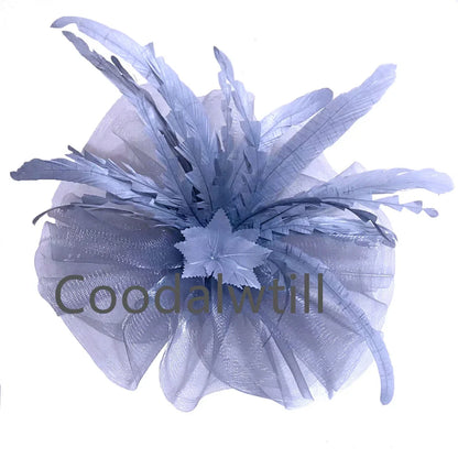 Chic Kentucky Derby fascinator hat designed for women, highlighting intricate feather accents, perfect for luxurious celebrations.
