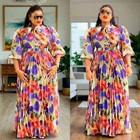 Elegant Plus Size African Print Maxi Dress in vibrant hues of purple, black, and pink, featuring 3/4 sleeves, perfect for evening parties and special occasions.