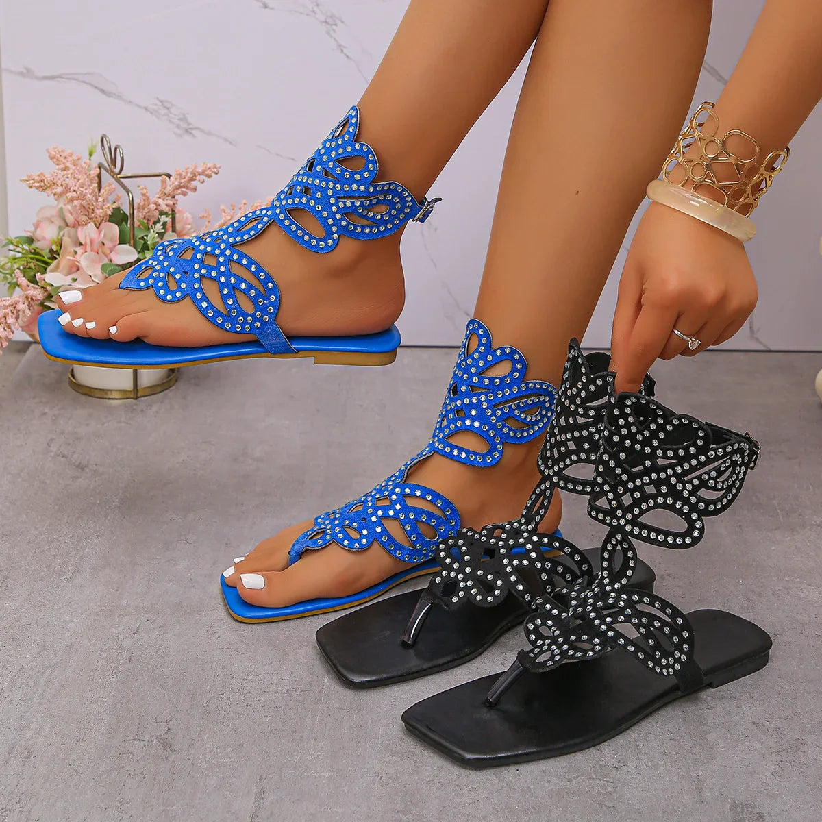 Stylish close-up of Chamliforve blue and black plus size sandals, featuring a unique buckle strap closure and luxurious texture suitable for relaxed summer wear.
