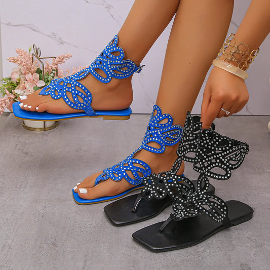 Stylish close-up of Chamliforve blue and black plus size sandals, featuring a unique buckle strap closure and luxurious texture suitable for relaxed summer wear.